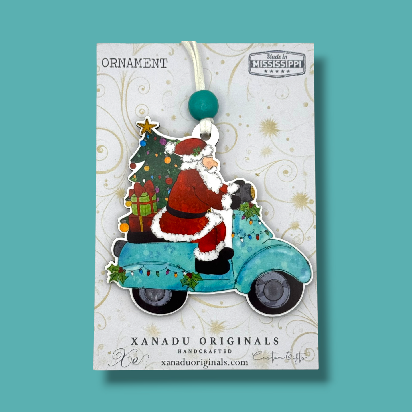 Santa Riding Turquoise Scooter Wooden Christmas Ornament with 2 Skin Tone Options