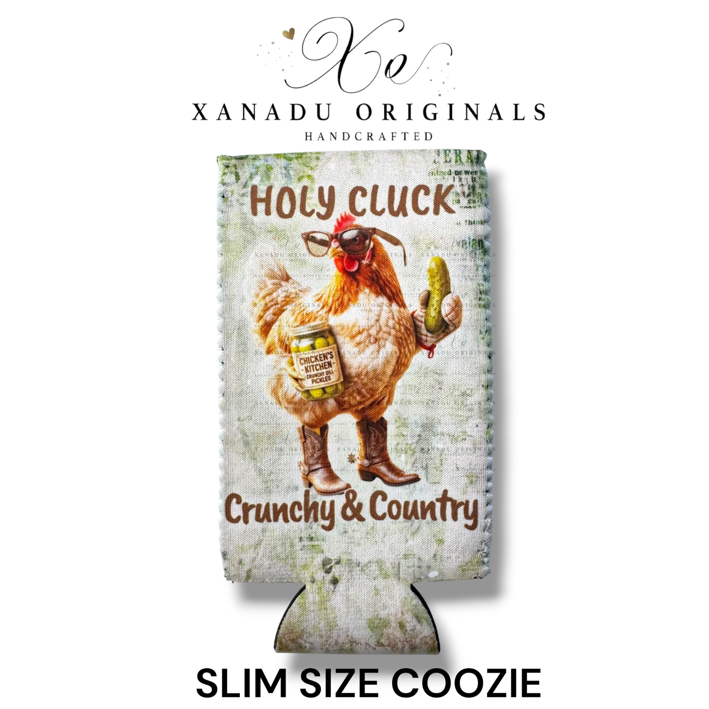 "Xanadu Originals handcrafted slim size neoprene can coozie featuring a rustic vintage country illustration of a chicken wearing cowboy boots and sunglasses holding a jar of dill pickles with the text 'Holy Cluck' and 'Crunchy & Country'."