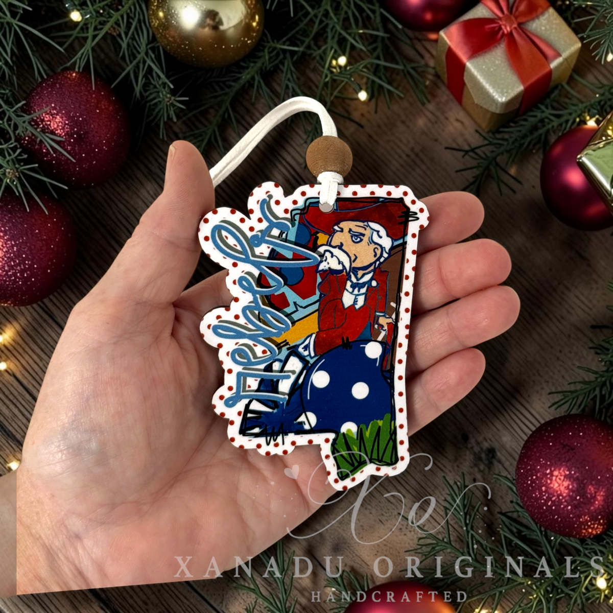 Whimsical Southern collegiate holiday Christmas ornament measuring 2.76 by 3.75 inches showing the detailed state outline.