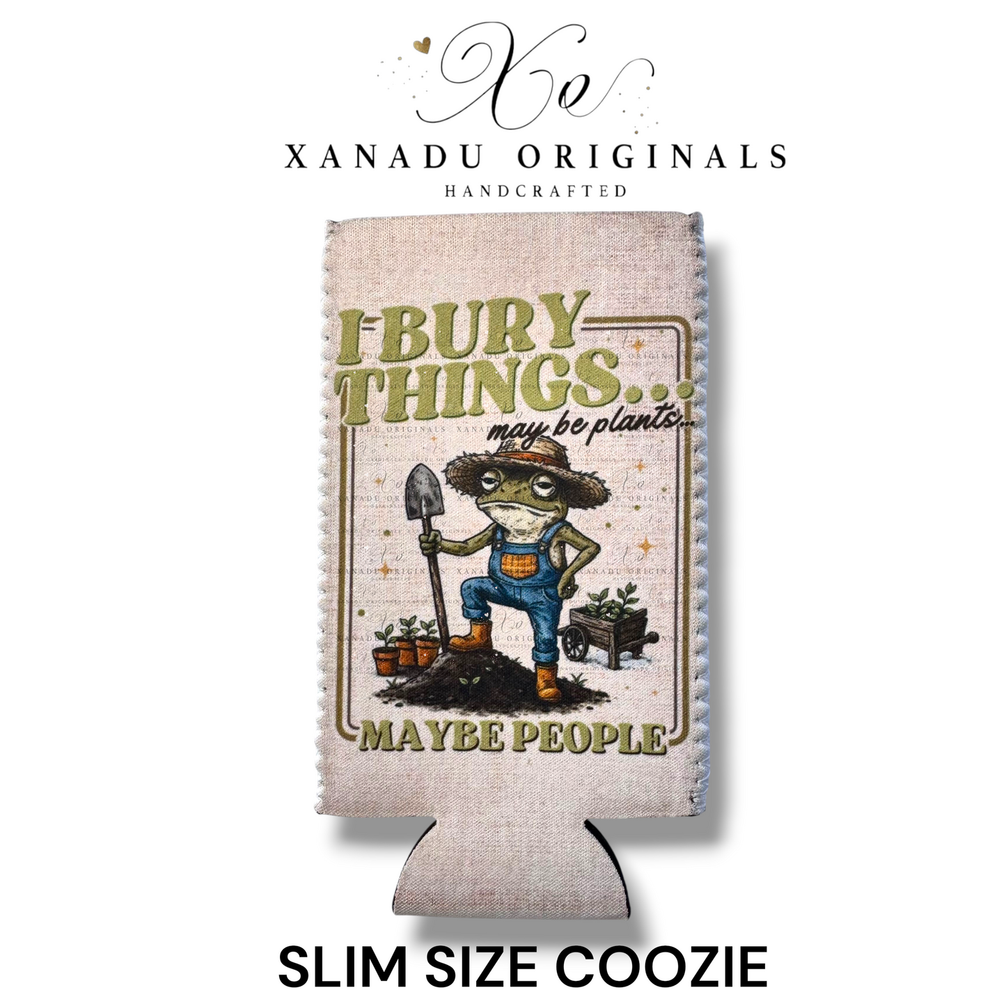 "Xanadu Originals handcrafted slim size neoprene can coozie featuring an illustrated green frog gardener in overalls holding a shovel with the text 'I bury things... may be plants... MAYBE PEOPLE' on a rustic canvas-textured background."