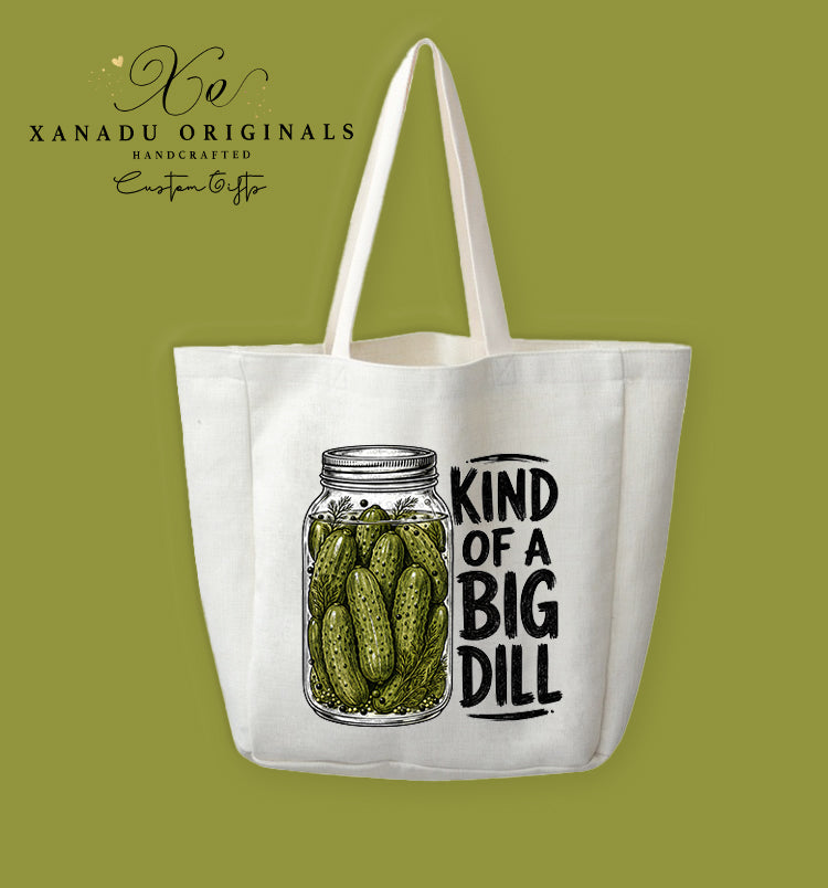 A cream-colored polyester linen tote bag featuring a detailed vintage sketch illustration of a mason jar full of pickles next to the bold text "KIND OF A BIG DILL".