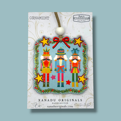 Nutcracker Trio Christmas Ornament with Colorful Holiday Border and Stars