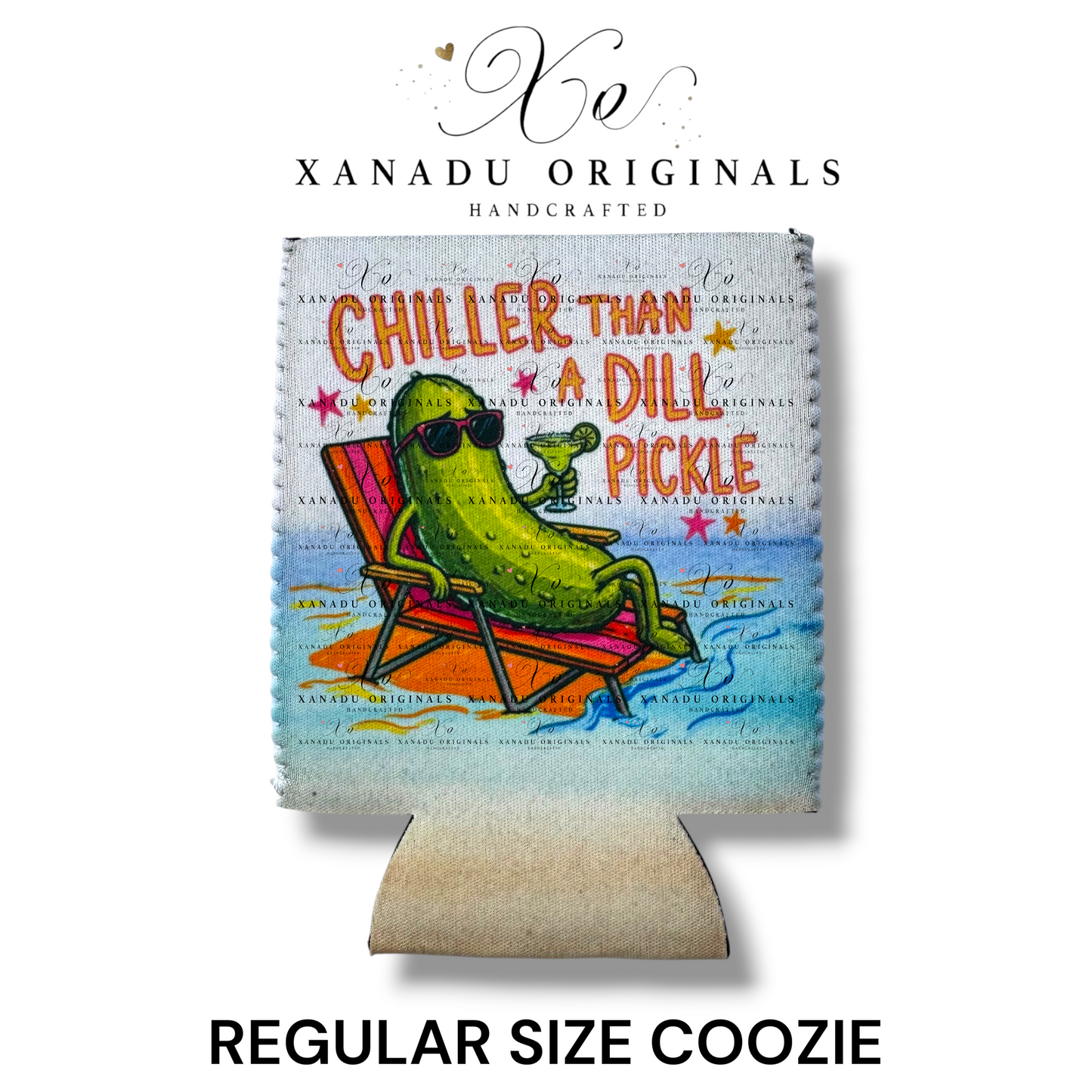 "Xanadu Originals handcrafted regular size neoprene can coozie featuring a colorful illustration of a cartoon dill pickle wearing sunglasses and lounging on a beach chair with a drink, alongside the text 'CHILLER THAN A DILL PICKLE' on a textured canvas background."