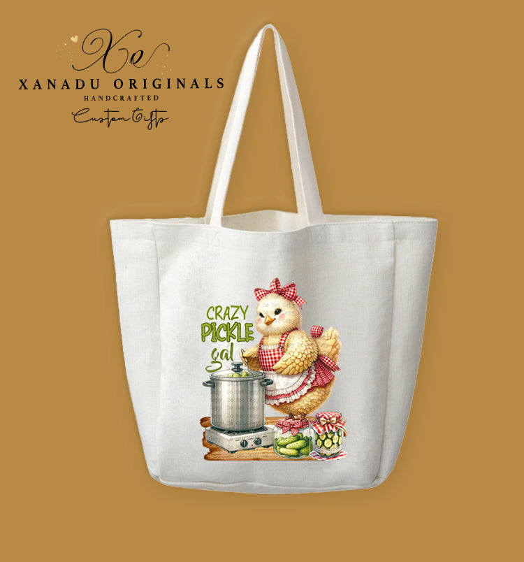 A cream-colored polyester linen tote bag featuring a country-style illustration of a fluffy chicken wearing a red apron, standing next to a canning pot and pickle jars with the text "CRAZY PICKLE GAL".