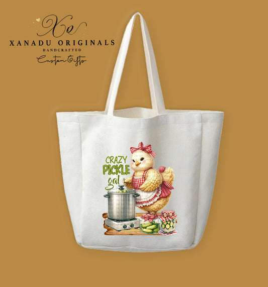 A cream-colored polyester linen tote bag featuring a country-style illustration of a fluffy chicken wearing a red apron, standing next to a canning pot and pickle jars with the text "CRAZY PICKLE GAL".