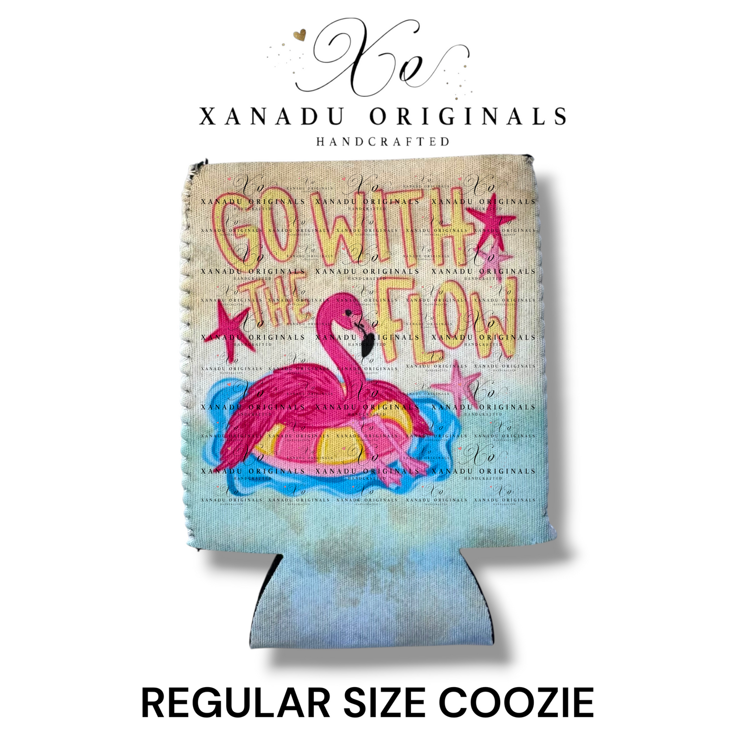 "Xanadu Originals handcrafted regular size neoprene can coozie featuring a colorful illustration of a pink flamingo floating in a yellow inner tube on pool water with the text 'GO WITH THE FLOW' and pink starfish on a textured canvas background."