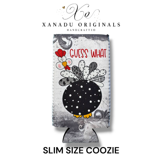 Xanadu Originals handcrafted grey neoprene slim can coozie featuring a funny black and white polka dot chicken turkey looking back with the red text reading Guess What