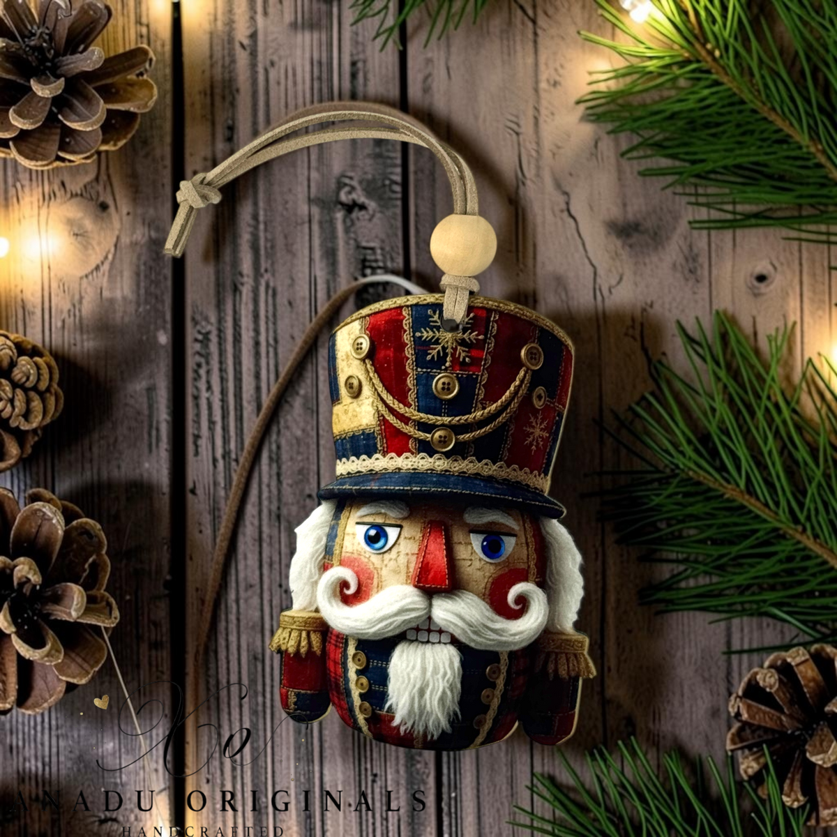 A handcrafted wooden nutcracker Christmas ornament with a detailed painted face, white beard, and ornate red, blue, and gold hat, hanging against a rustic wood background with pine branches and warm lights.