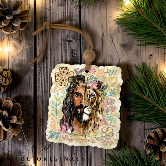 Lion and the lamb Jesus wood ornament featuring a split face portrait with a floral crown of thorns on a textured floral background with a suede tie.