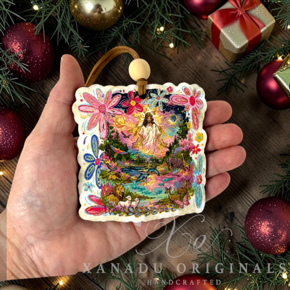 • Retro religious Bible story Christmas ornament measuring 3.36 by 3.55 inches held in a hand next to festive holiday decorations.
