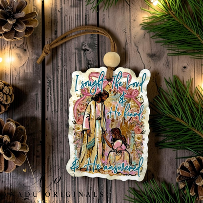 I Sought the Lord wood ornament featuring a colorful folk art illustration of Jesus comforting a kneeling girl surrounded by pink roses and scripture text.