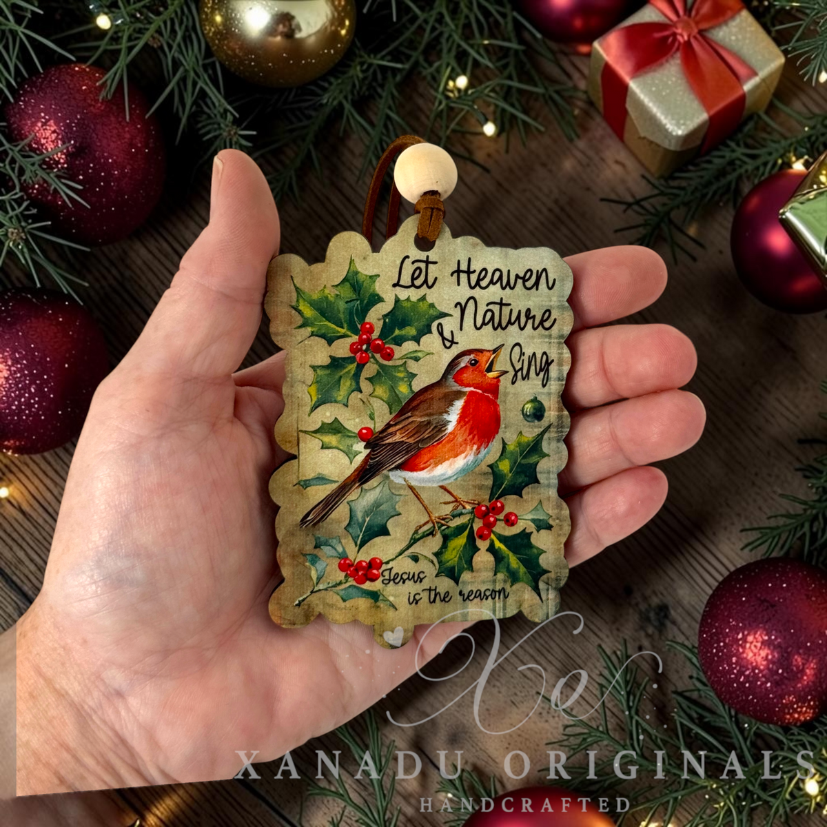 • Retro religious Christmas bird ornament measuring 2.71 by 3.85 inches held in a hand next to holiday tree decorations.
