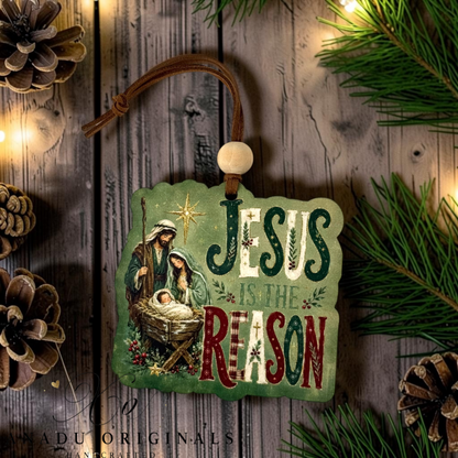 Jesus is the Reason wood ornament featuring a classic nativity scene with Mary, Joseph, and Baby Jesus against a deep green textured backdrop.