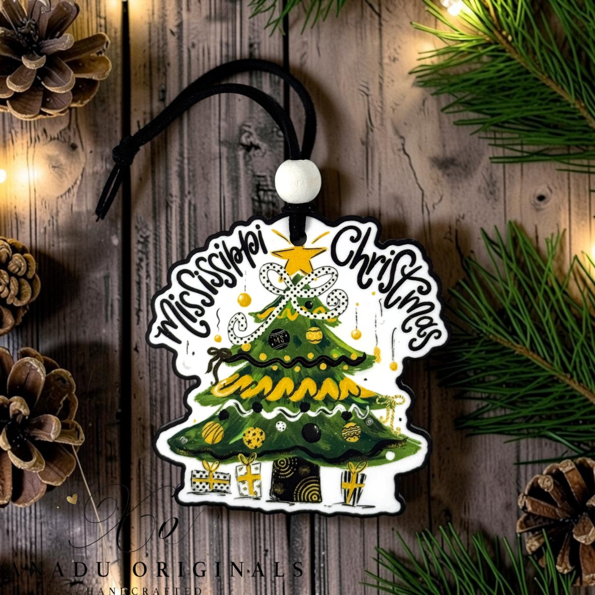 Southern Miss Christmas wood ornament featuring a retro decorated evergreen tree with a black polka dot bow and black and gold patterned holiday presents.
