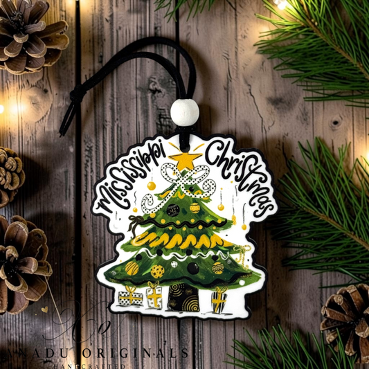 Southern Miss Christmas wood ornament featuring a retro decorated evergreen tree with a black polka dot bow and black and gold patterned holiday presents.