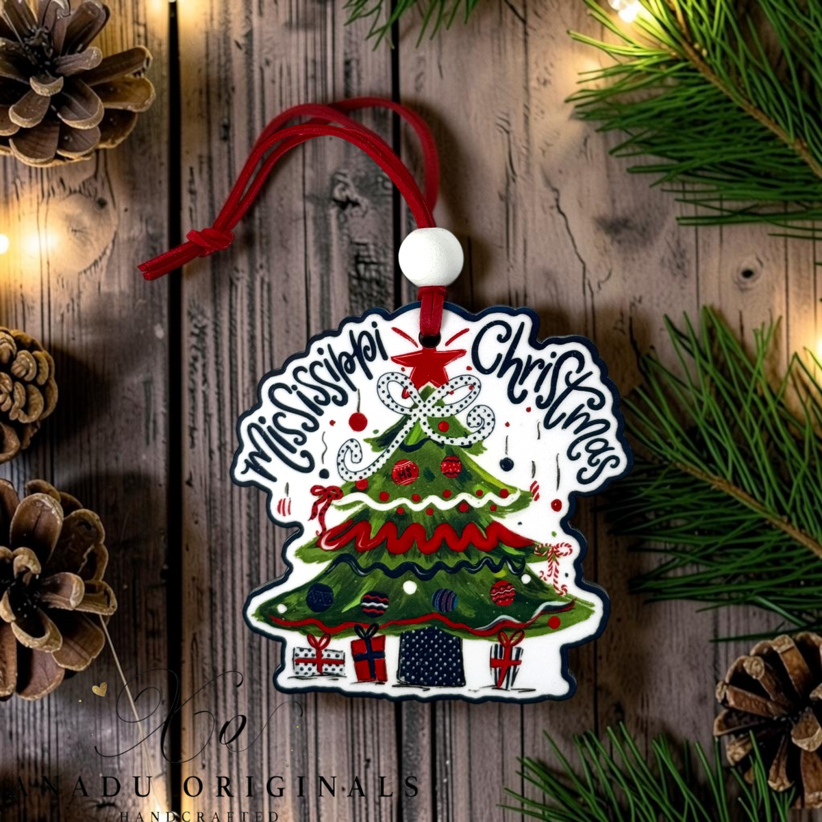 Mississippi Christmas wood ornament featuring a retro decorated evergreen tree with a white polka dot bow and navy blue patterned holiday presents beneath it.