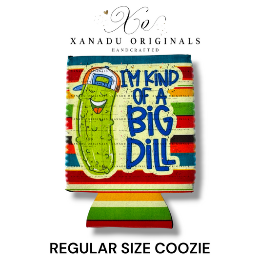 "Xanadu Originals handcrafted regular size neoprene can coozie featuring an illustrated cartoon pickle wearing a backwards blue hat beside the bold text 'I'M KIND OF A BIG DILL' over a vibrant retro multi-color horizontal striped background."