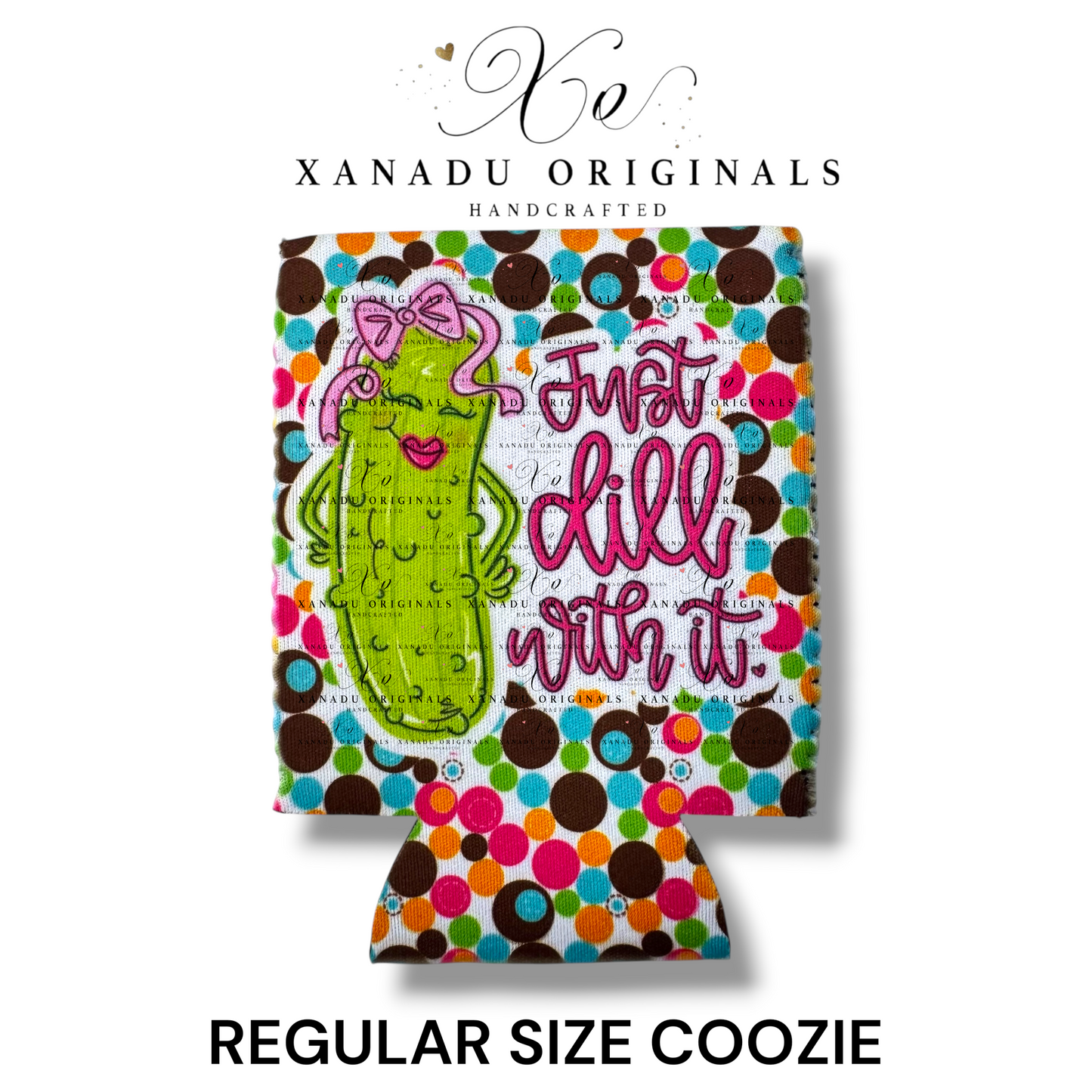 "Xanadu Originals handcrafted regular size neoprene can coozie featuring an illustrated sassy cartoon pickle with a pink bow and lipstick beside the pink script text 'Just dill with it.' over a vibrant retro multi-color polka-dot background."