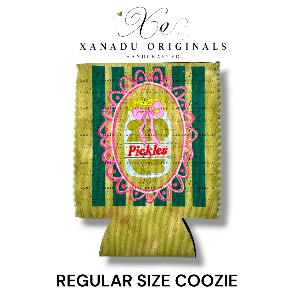 "Xanadu Originals handcrafted regular size neoprene can coozie featuring an illustrated glass jar of pickles inside a hot pink lace frame decorated with a large pink bow and the red text 'Pickles' against an olive green and yellow striped background."
