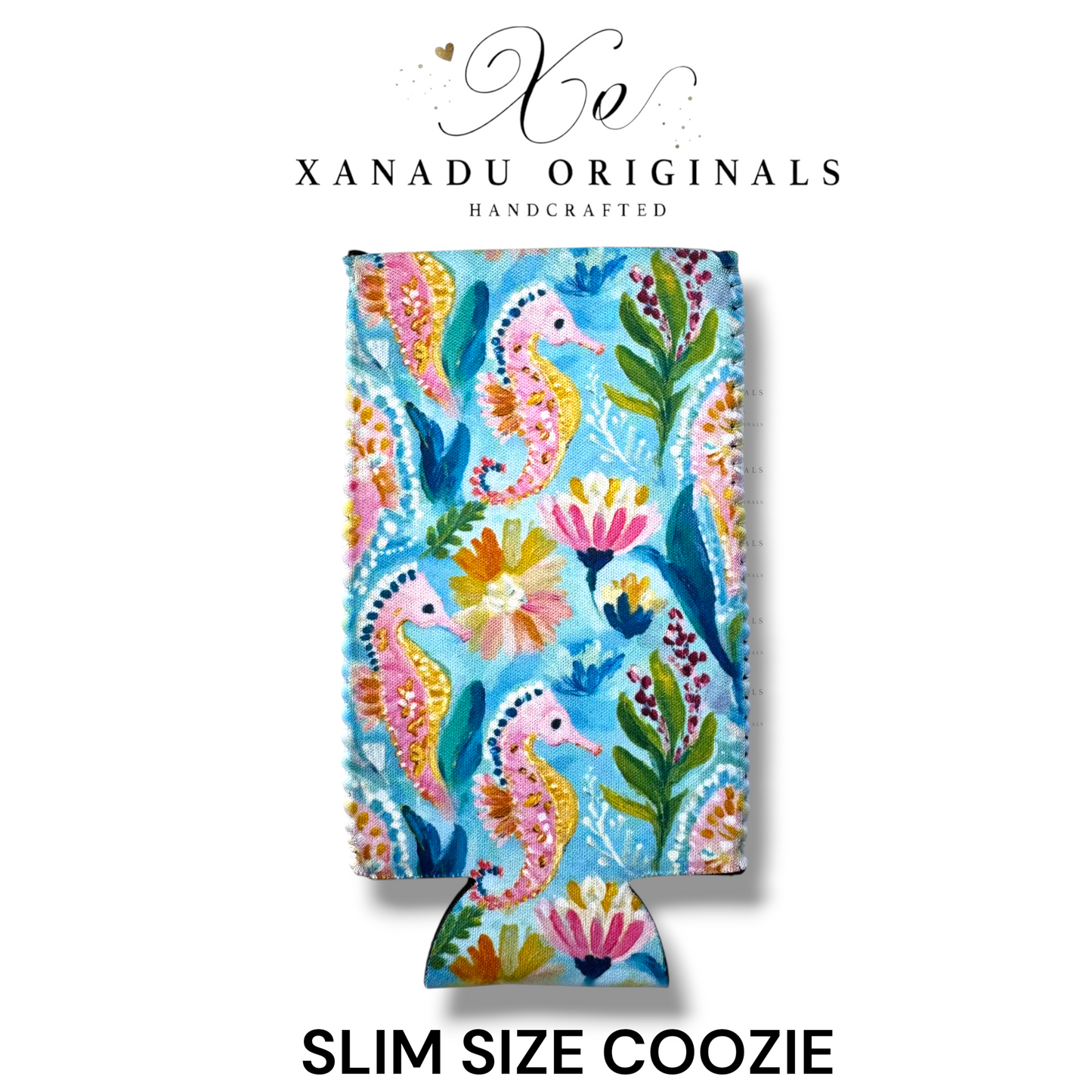 "Xanadu Originals handcrafted slim size neoprene can coozie featuring a vibrant repeating pattern of illustrated pink and yellow seahorses with tropical flowers and green seaweed on a blue background."