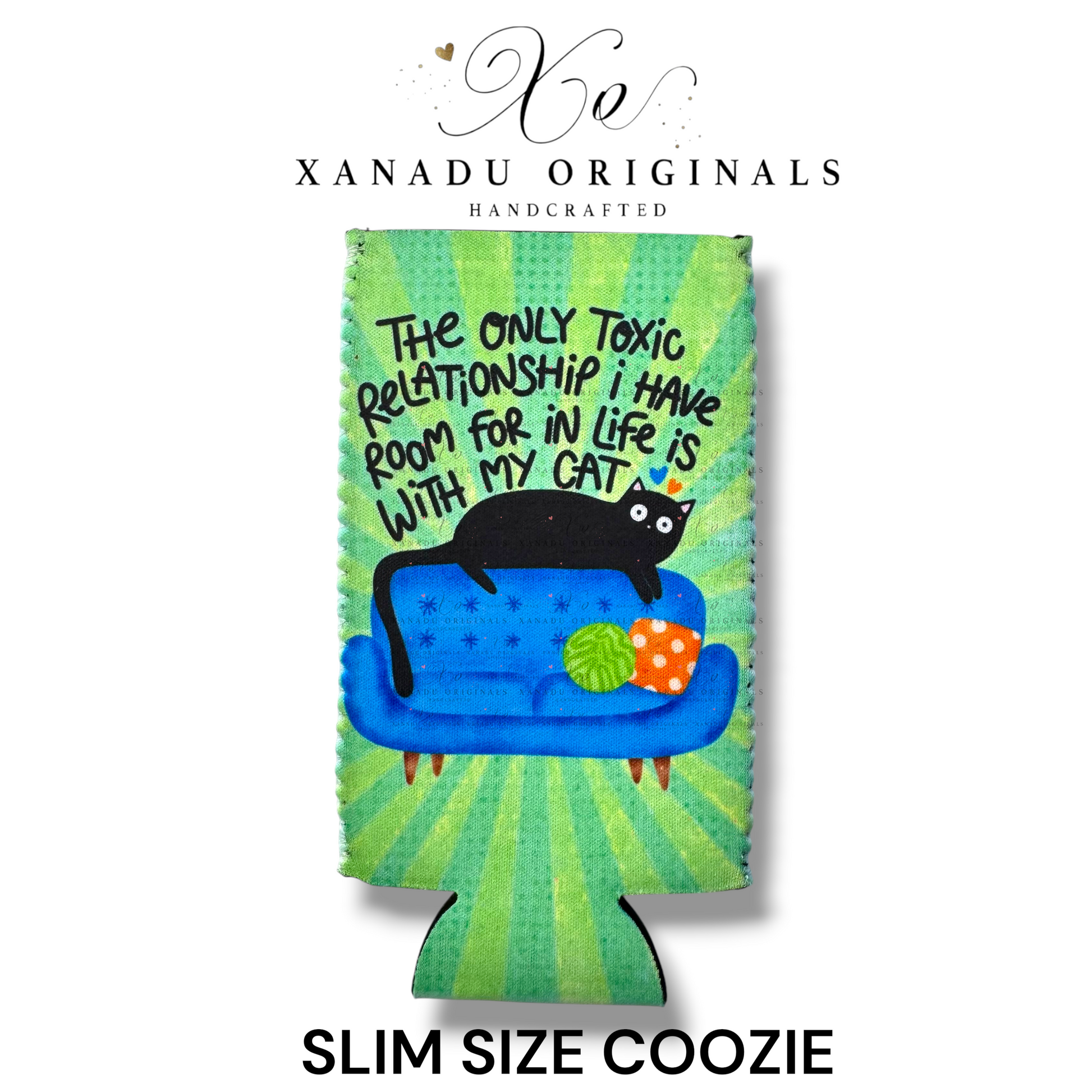 "Xanadu Originals handcrafted slim size neoprene can coozie featuring a black cat laying on a blue couch with the funny quote 'The only toxic relationship I have room for in life is with my cat' on a vibrant green starburst background."