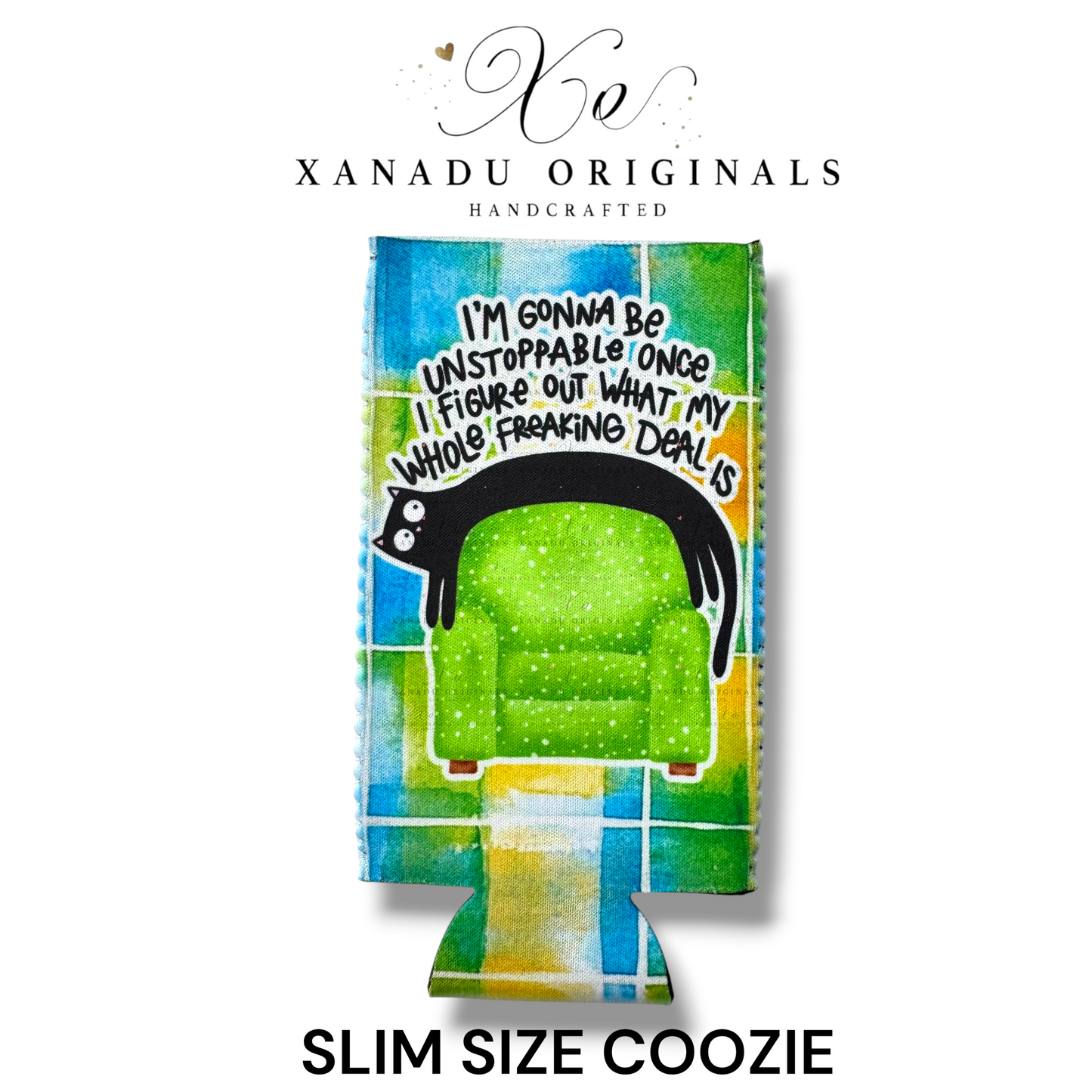"Xanadu Originals handcrafted slim size neoprene can coozie featuring a black cat stretched across a lime green armchair with the funny text 'I'm gonna be unstoppable once I figure out what my whole freaking deal is' over a colorful teal and yellow plaid background."